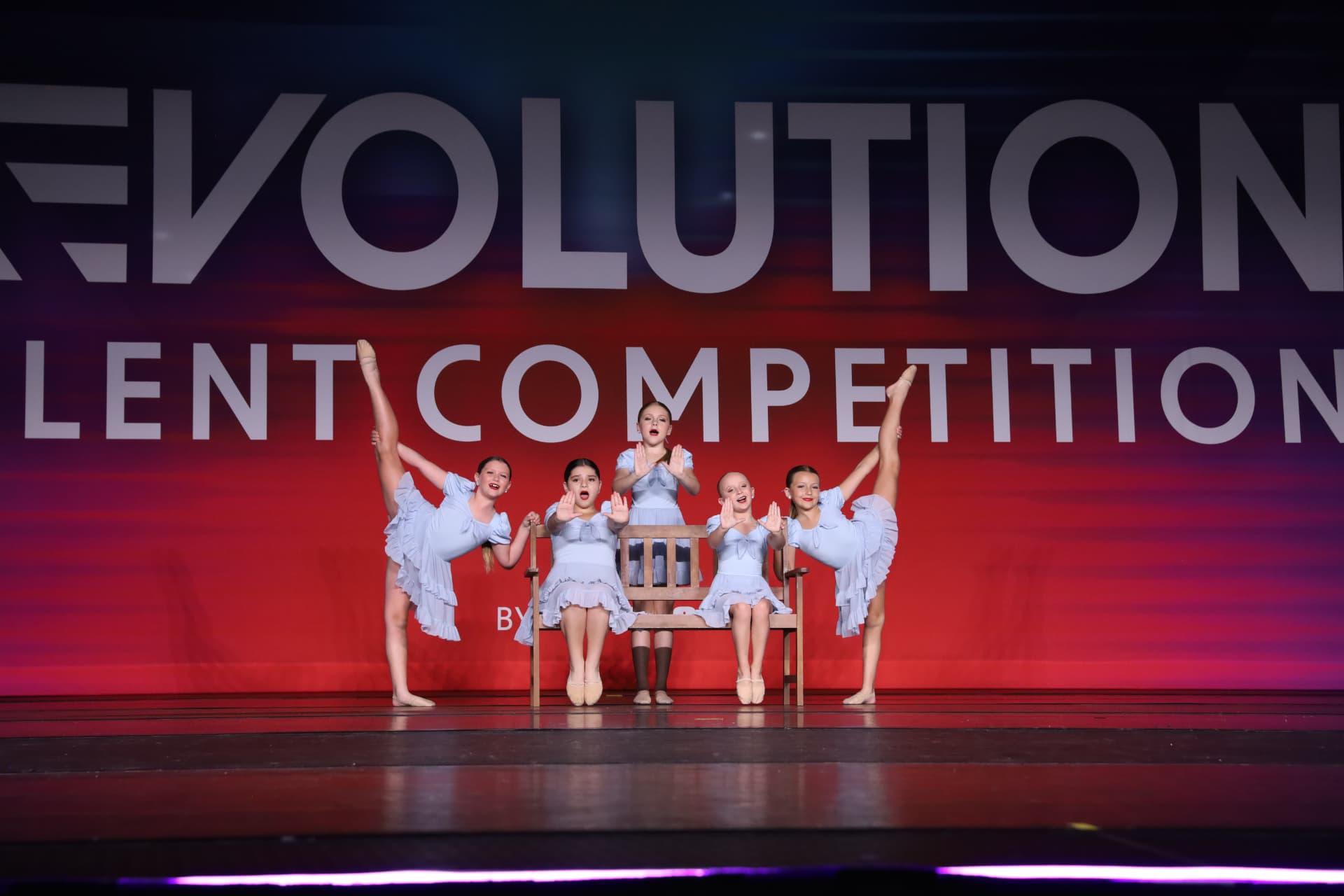 Five dancers performing a ballet number in pale blue costumes