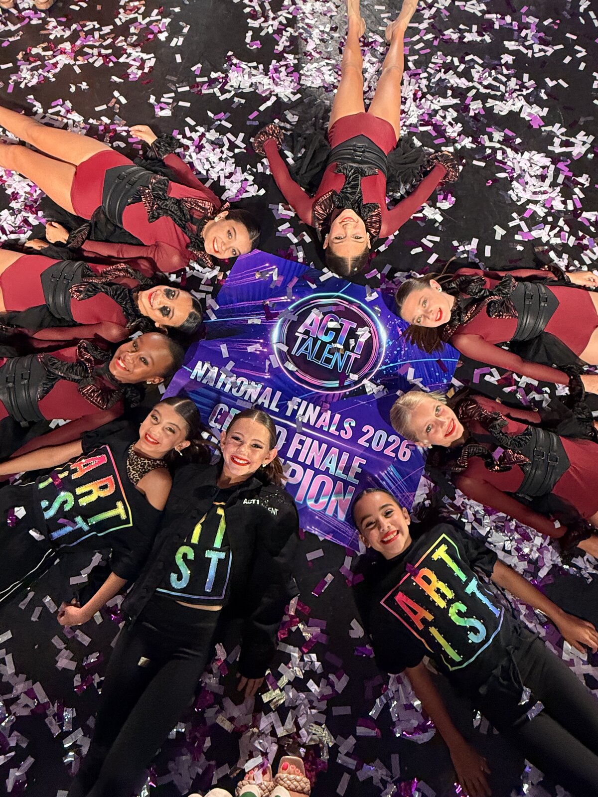 MSDC dancers gathered around their 2026 Grand Finale Champion banner