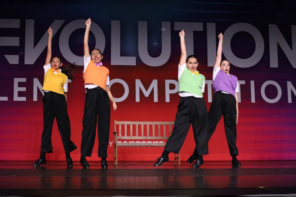 Four MSDC dancers finishing a tap number on the national competition stage